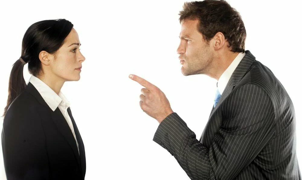 man-pointing-finger-at-woman